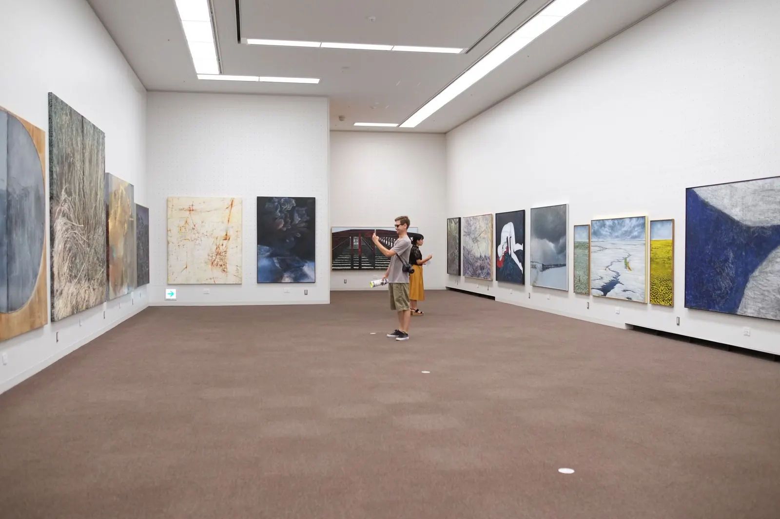 Bright modern art gallery with large paintings